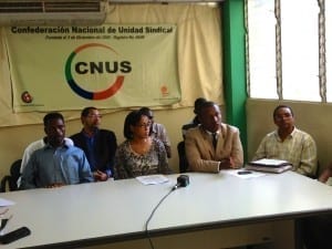 Dominican unionists and Haitian workers seek justice for unpaid coconut plant workers. Credit: Geoff Herzog