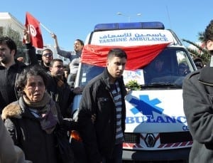 Tunisians accompany the ambulance carrying Belaid's body. Credit: Sarah Mersch