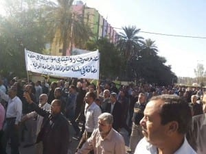 Carrying signs protesting unpaid wages, Iraqi textile workers were among workers from several industries demanding back pay. Credit: Ali Rakeb