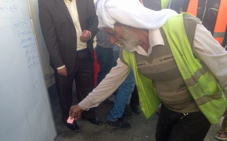 Iraqi workers cast their votes for a union committee at Gulftainer in Om Qasr.