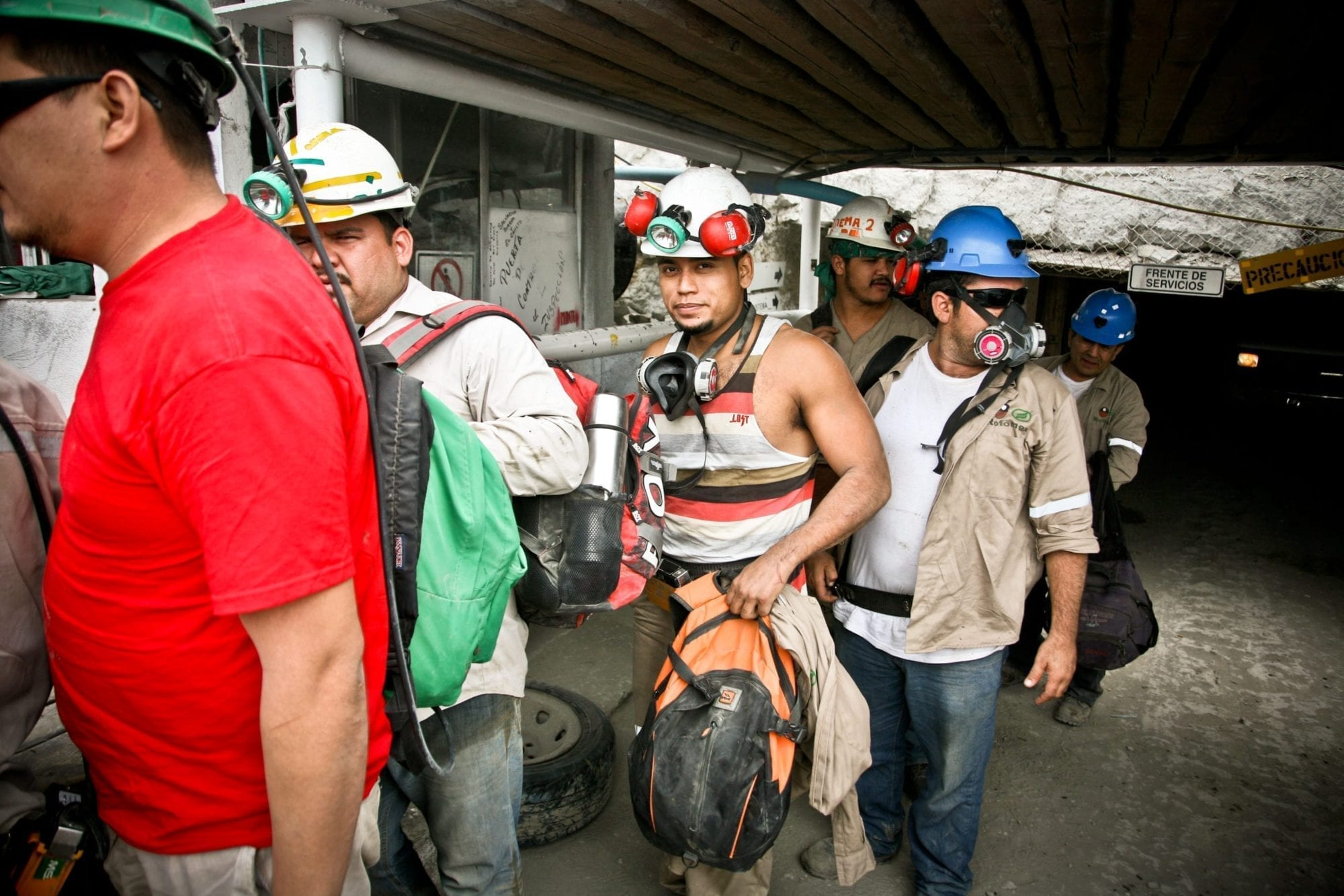 Miners in the Monje mine shaft finish the morning shift