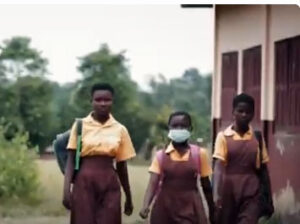 Girls walking to school in Torkor village where GAWU, a Ghana agricultural union, is helping children leave cocoa production for school